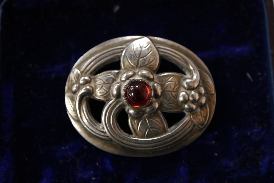 A Georg Jensen 925S and single stone cabochon garnet set oval brooch, design no. 138, 38mm.
